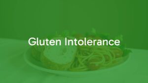 A plate of gluten-free bread and pasta with fresh vegetables, soft focus background, warm and inviting lighting, realistic.